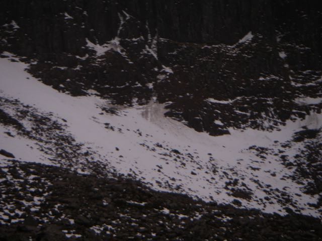 Mucky slide marks indicate small wet snow slide after overnight thaw.
