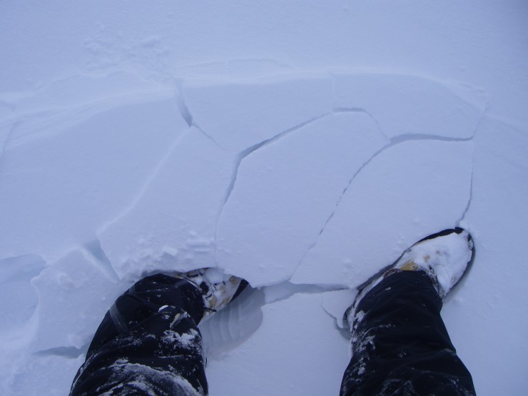 Cracking underfoot at the edge of a drift. The fresh windslab is not very stable. 