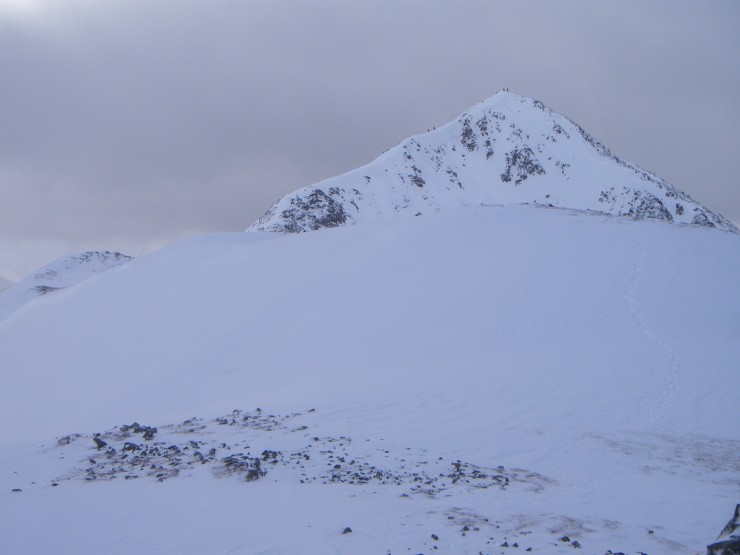 Walker approaching and on the summit of Stob Dubh. 