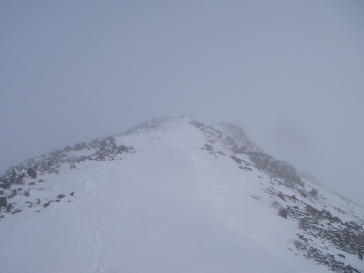 The summit of Meall a Bhuiridh shrouded in mist.