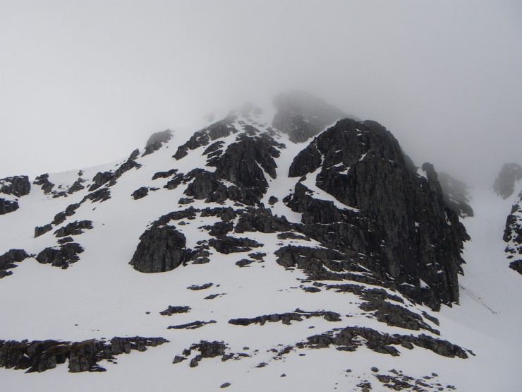 Stob Coire nan Lochan's summit obscured by mist, the upper couloir of Boomerang Gully visible in centre of picture.