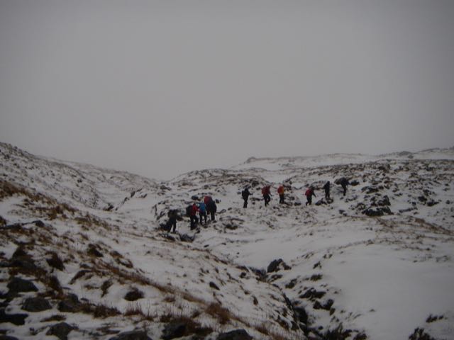Plenty of people on the hill despite the conditions, approaching the bealach on Buachaille Etive Beag.