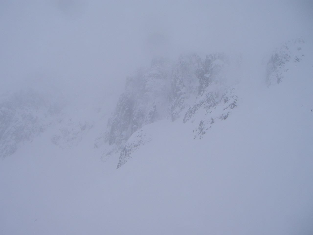 View across the Lochan cliffs showing snow laden faces