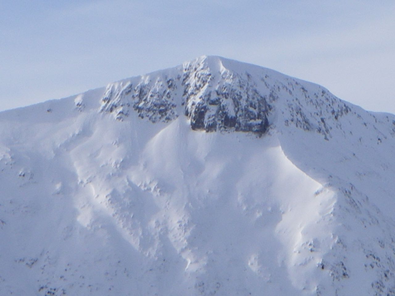 Stob Coire Altruim with wind sculptured ridge below the crag