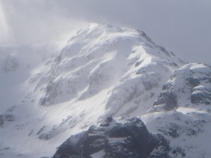 New snow overnight and this afternoon, blustery.