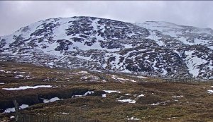 Mild conditions leave patchy snow cover…..